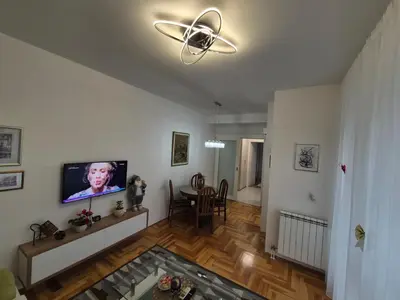 a living room with a flat screen tv on a wall at Urban BL in Banja Luka