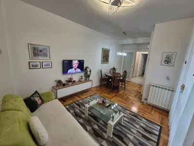 a living room with a couch and a tv at Urban BL in Banja Luka