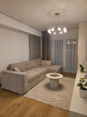 a living room with a couch and a table at Palace Residence Apartment in Banja Luka