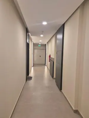 an empty corridor in an office building with a long hallway at Palace Residence Apartment in Banja Luka
