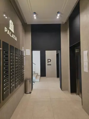 a hallway in a building with a restroom at Palace Residence Apartment in Banja Luka