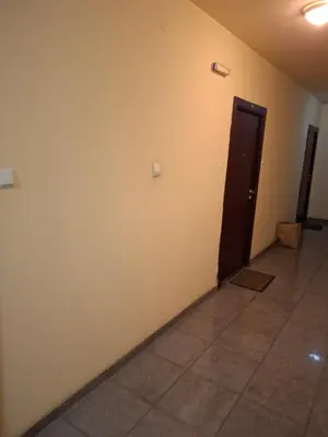 an empty room with a door and a tile floor at Studio apartman in Banja Luka