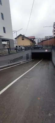 a bridge over a road with a parking lot at GOLD Apartmani Banja Luka in Banja Luka