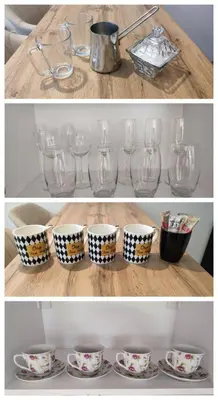 a group of glasses and cups on a table at GOLD Apartmani Banja Luka in Banja Luka