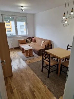 a living room with a couch and a table at Ada flat in Banja Luka