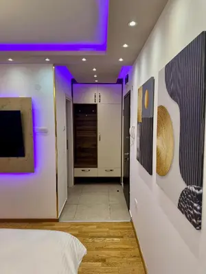 a room with a bed and a purple ceiling at Jelena Apartments in Banja Luka