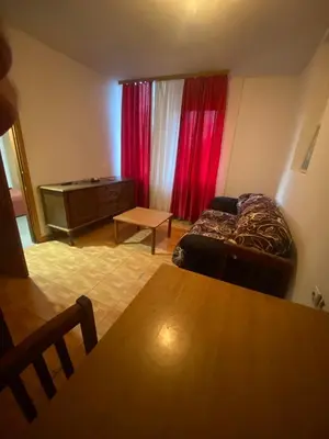 a living room with a couch and red curtains at Veliko Brdo BL in Banja Luka
