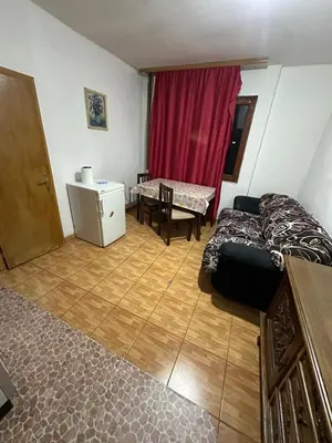 a living room with a bed and a table at Veliko Brdo BL in Banja Luka