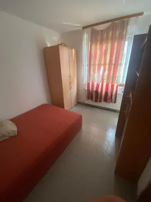 a small bedroom with a red bed and a window at Veliko Brdo BL in Banja Luka