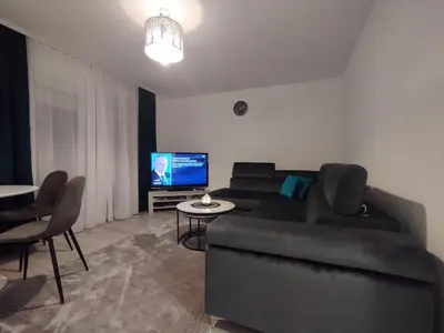 a living room with a couch and a tv at Old Town in Livno