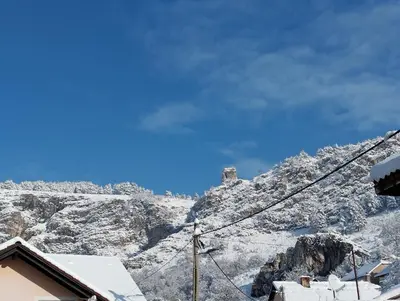 a view of a mountain with snow on it at Old Town in Livno