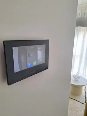 a television hanging on a wall in a room at Urban Cube Apartment - Tuzla City Center in Tuzla