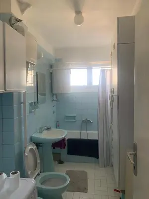 a bathroom with a toilet and a sink and a tub at Slobo- stan na dan in Banja Luka