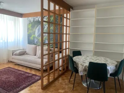 a living room with a couch and a table at Slobo- stan na dan in Banja Luka
