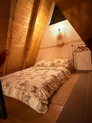 a bedroom with a bed in a attic at Harmony cottage in Banja Luka