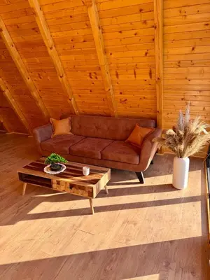 a living room with a couch and a coffee table at Harmony cottage in Banja Luka