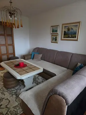 a living room with a couch and a coffee table at Apartment SOFI Novi Travnik in Novi Travnik