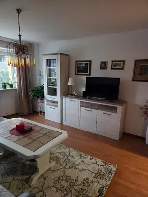 a living room with a tv and a table at Apartment SOFI Novi Travnik in Novi Travnik