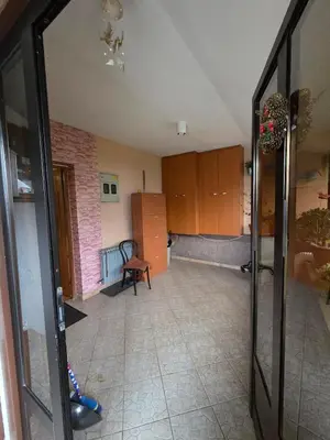 a living room with a room with a brick wall at Apartment SOFI Novi Travnik in Novi Travnik