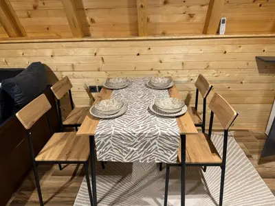 a dining room with a table and four chairs at Soul Rest in Visoko