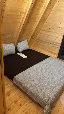 a room with a bed in a tiny house at Soul Rest in Visoko