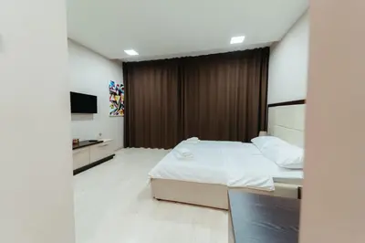 a hotel room with a bed and a television at Koncept RK in Banja Luka