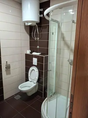 a bathroom with a toilet and a glass shower at Koncept RK in Banja Luka