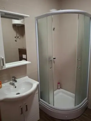 a bathroom with a shower and a sink at Koncept RK in Banja Luka