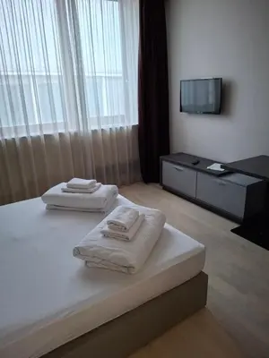 two towels on a bed in a hotel room at Koncept RK in Banja Luka