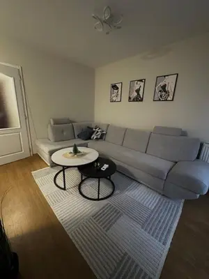 a living room with a couch and a table at Apartman ARENA 2 Doboj in Doboj