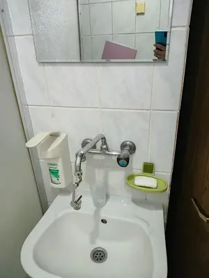 a bathroom with a sink and a toilet at KONAK kod ODISEJE 3 in Tuzla