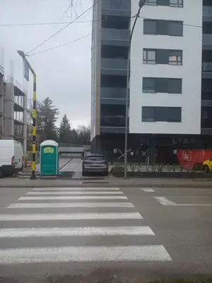 a car parked at a crosswalk in a city at Apartman Kratos in Banja Luka