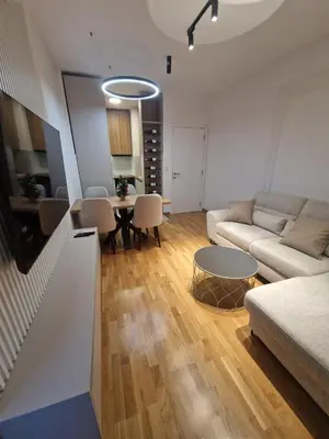 a living room with a couch and a table at Apartman Damjan in Banja Luka