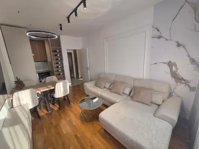 a living room with a couch and a table at Apartman Damjan in Banja Luka