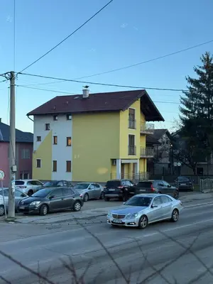 a group of cars parked in front of a building at Papa Glisa in Banja Luka