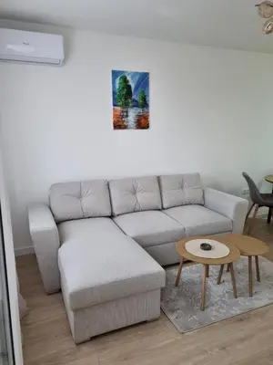 a living room with a couch and a table at Apartman Mila in Doboj