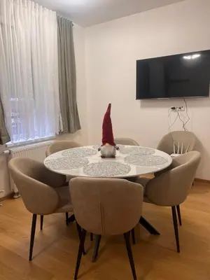 a table with a gnome sitting on top of it at Taša 1 in Banja Luka