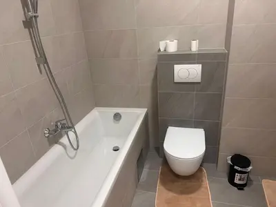 a bathroom with a toilet and a tub and a sink at Taša 1 in Banja Luka