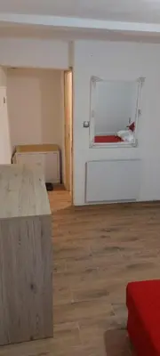 an empty room with a table and a window at Apartman Ani in Hiseti