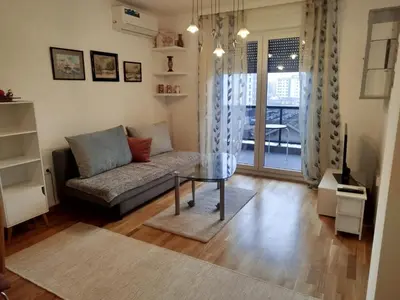 a living room with a couch and a table at Ela in Banja Luka