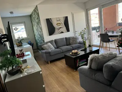 a living room with a couch and a table at Luxe Residence Home Sweet Home City Center in Banja Luka