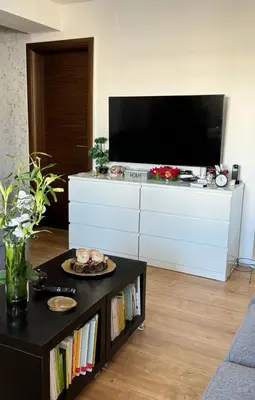 a living room with a tv and a coffee table at Luxe Residence Home Sweet Home City Center in Banja Luka