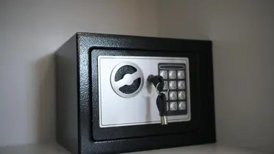 a black and white object with a remote control at Apartmani Flocke Vlašić in Šišava