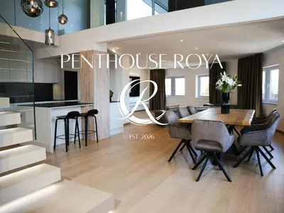 a dining room and kitchen with a table and chairs at PENTHOUSE ROYA BiHAC in Bihać