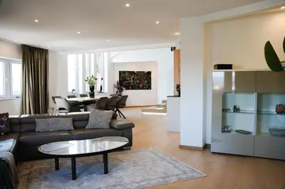 a living room with a couch and a table at PENTHOUSE ROYA BiHAC in Bihać