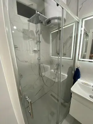 a shower with a glass door in a bathroom at Apartment Vilsonova in Banja Luka