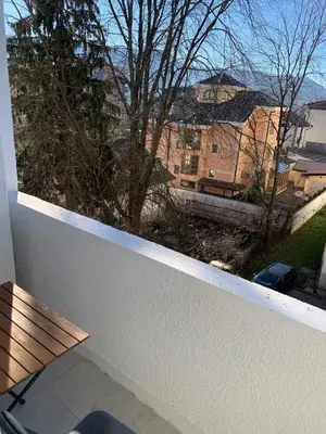 a balcony with a bench and a view of a building at Apartment Vilsonova in Banja Luka