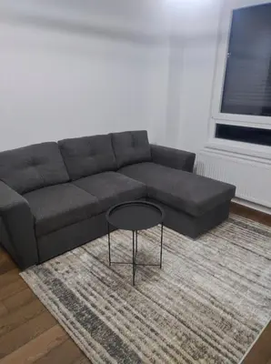 a living room with a couch and a table at Triton in Banja Luka