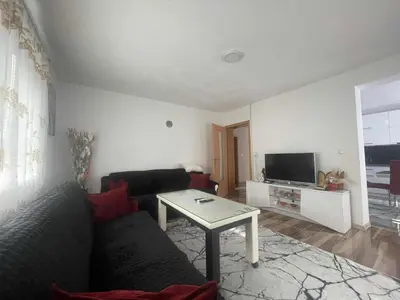 a living room with a couch and a table at Zanesovici Jezero in Bugojno