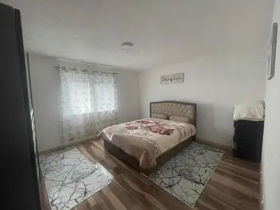 a bedroom with a bed and a window at Zanesovici Jezero in Bugojno